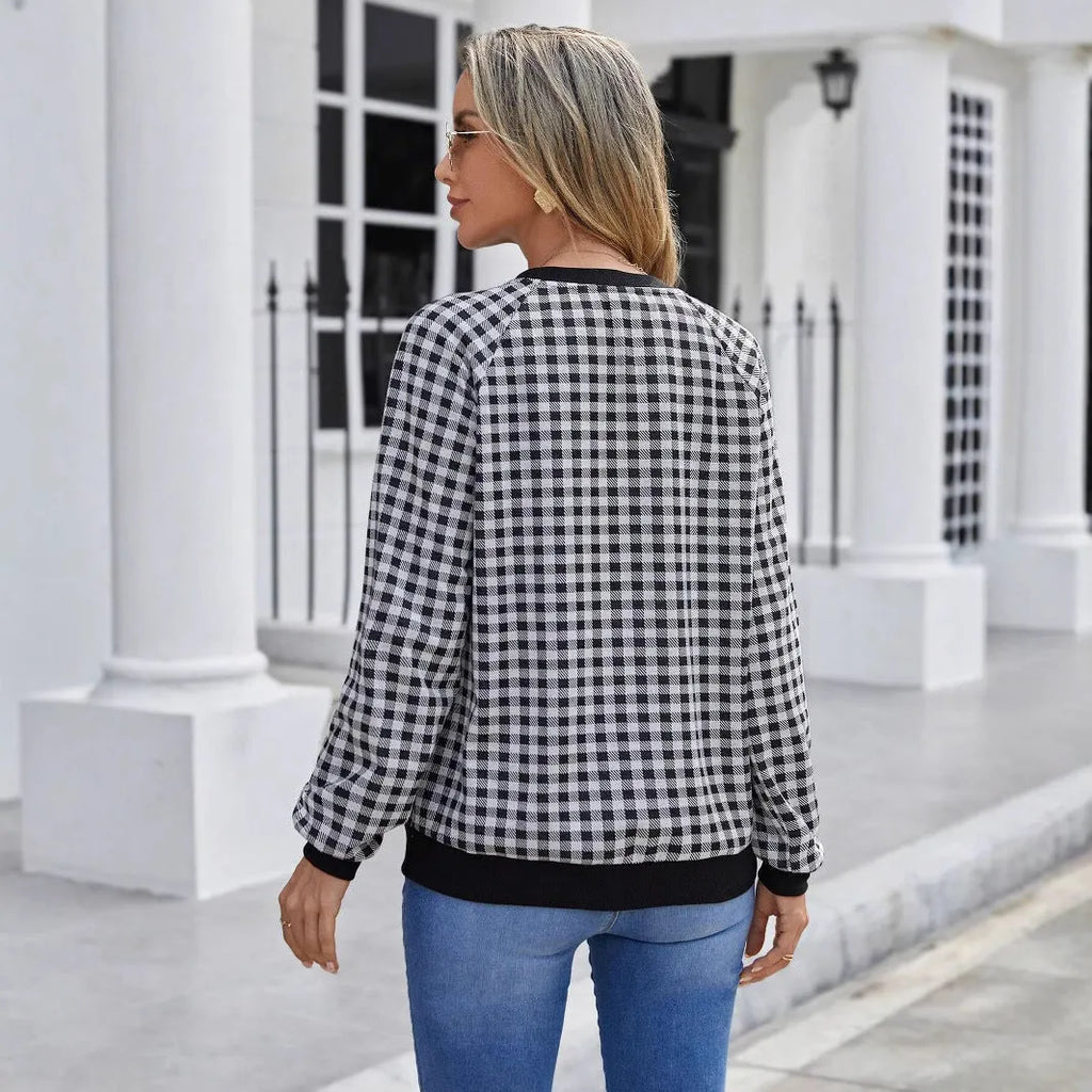 Black men's long sleeve sweater with a striped plaid print pattern.