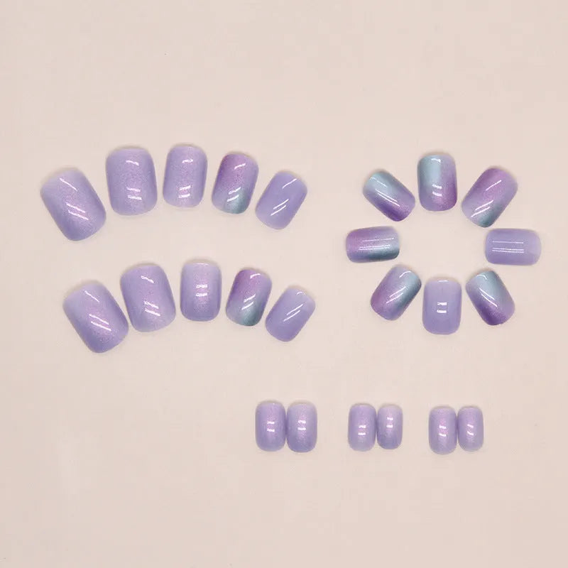 Short fake nails in bright starry sky pattern, 24-piece set with glue, aurora armour style for ladies.
