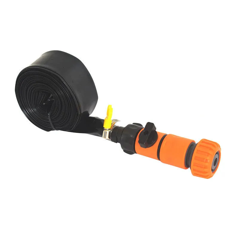 Blue portable plastic garden sprinkler with solar panel on green grass.