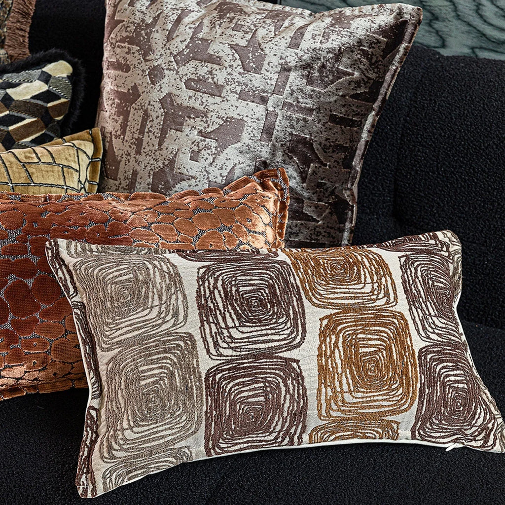 Abstract coil pattern cushion cover with piping trim in cream and coffee colours