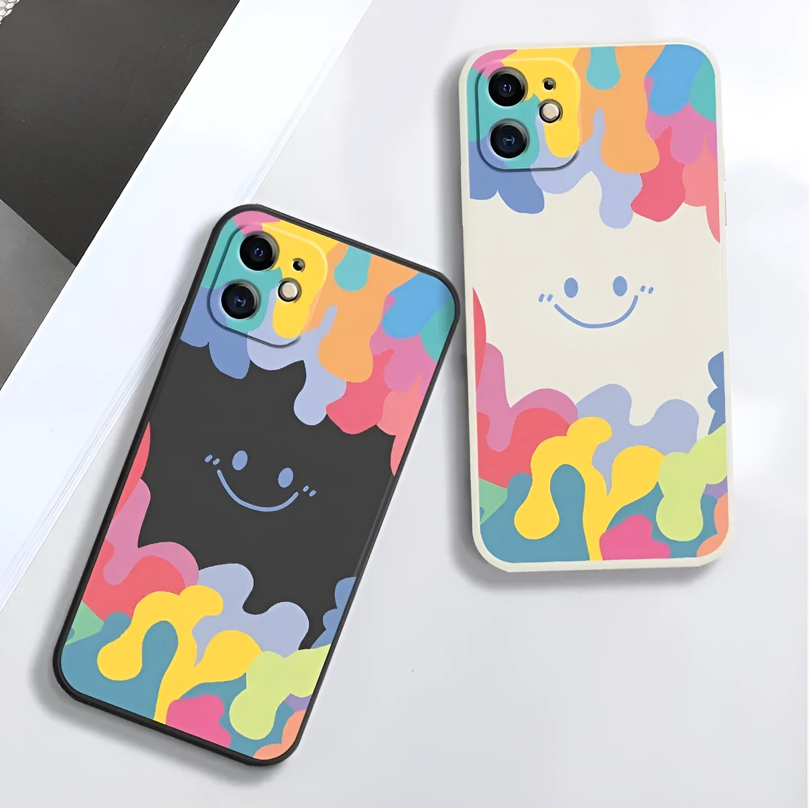 White TPU iPhone case with rainbow smiley face design and attached lanyard