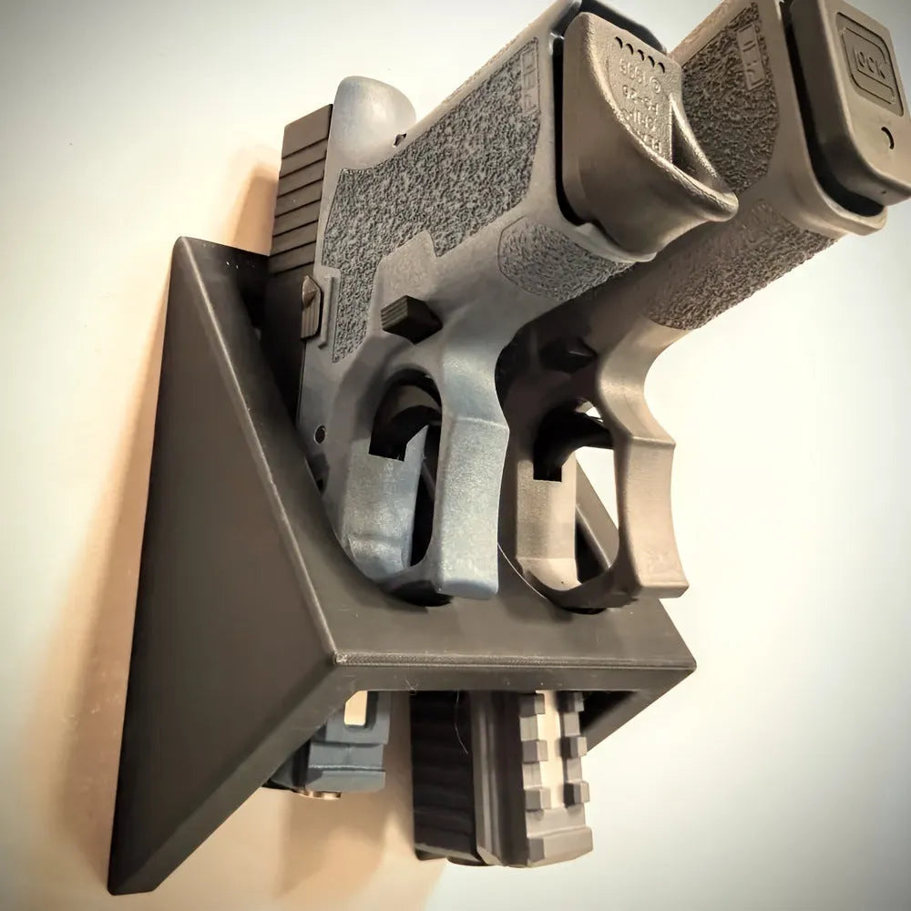 Black plastic punk-style pistol stand for replica firearm display