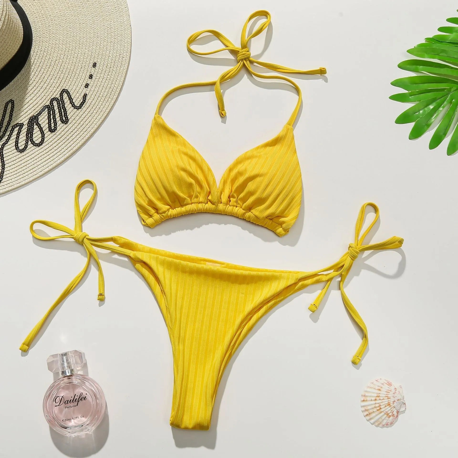 Yellow and dark green women's solid colour triangle bandeau bikini set on a mannequin.