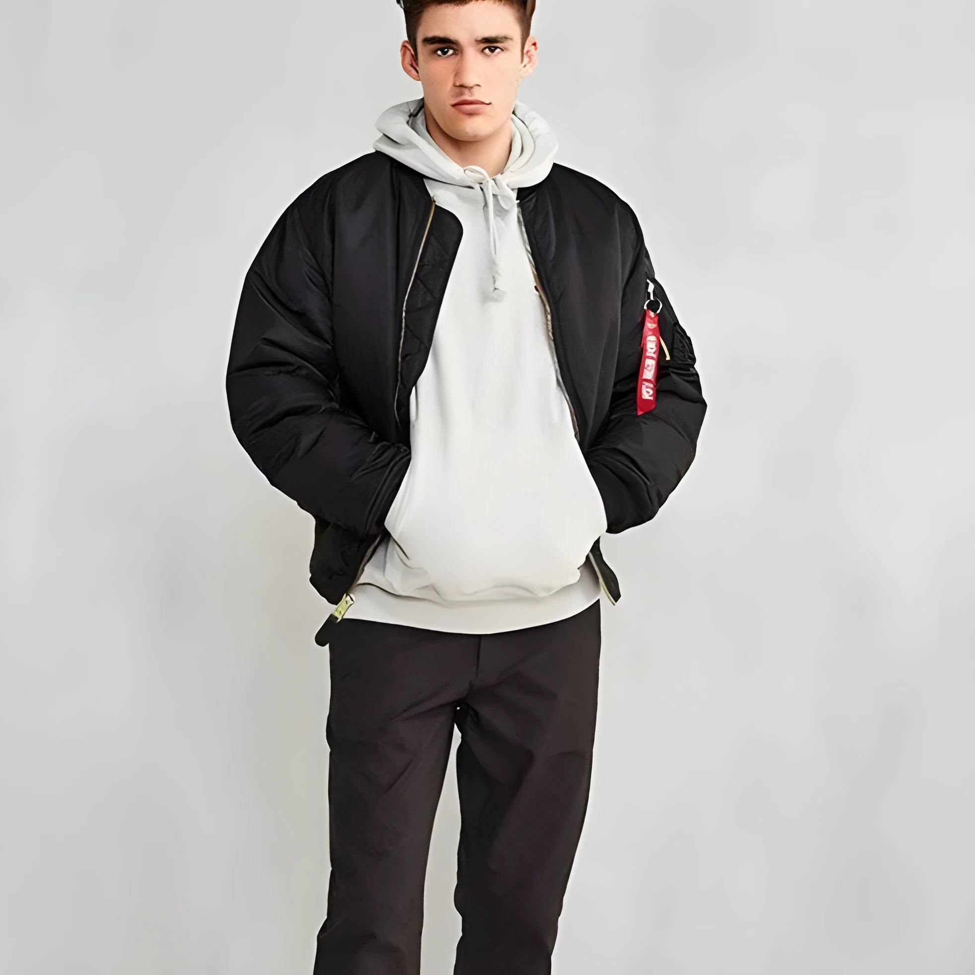 Men's loose fit army green cotton-padded pilot jacket on a hanger.