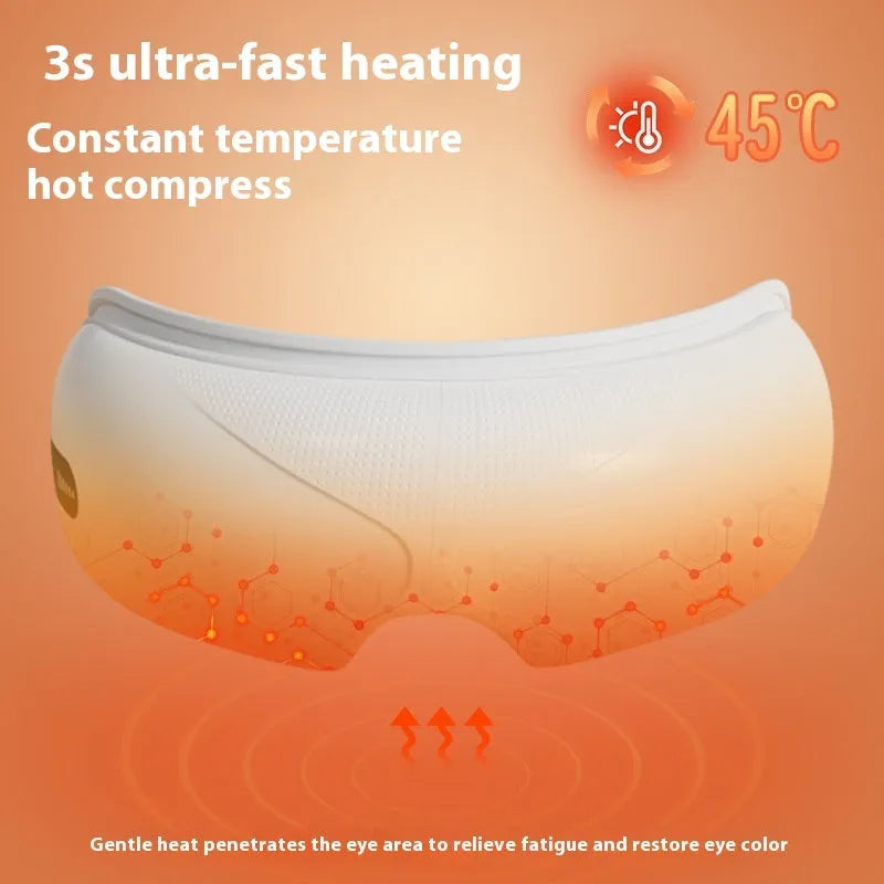 White rechargeable airbag eye massager with heat compress function on a grey background.
