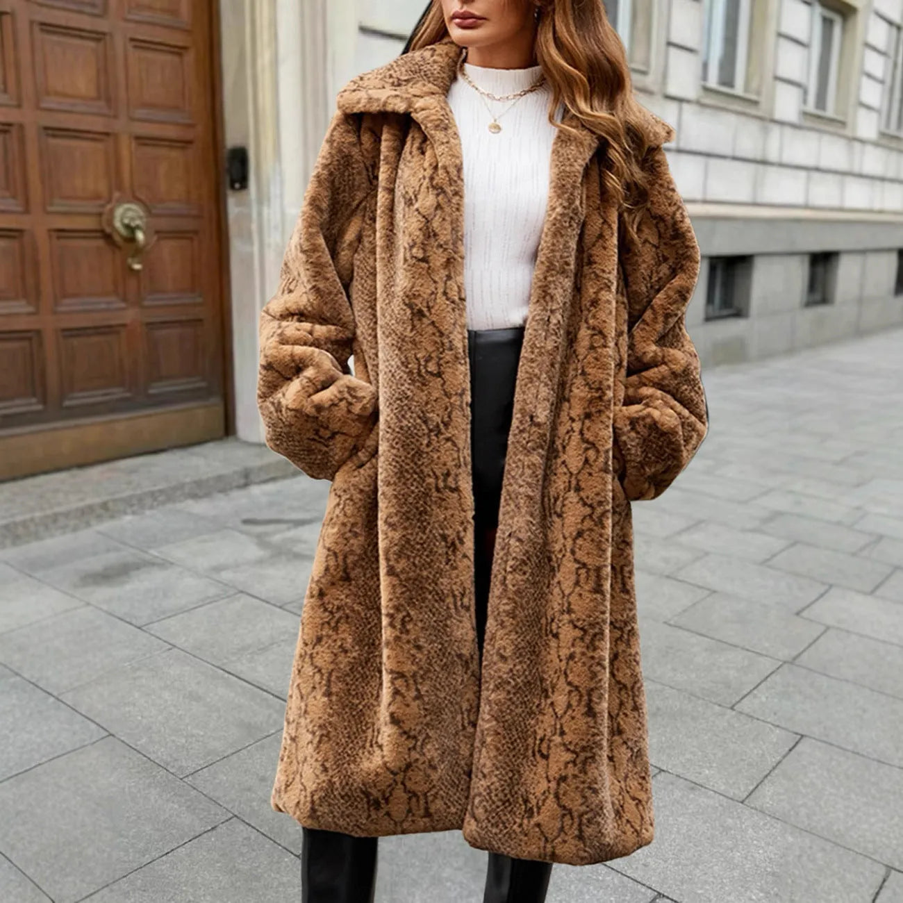 Women's long white leopard print faux fur coat with regular sleeves, shown on a model.