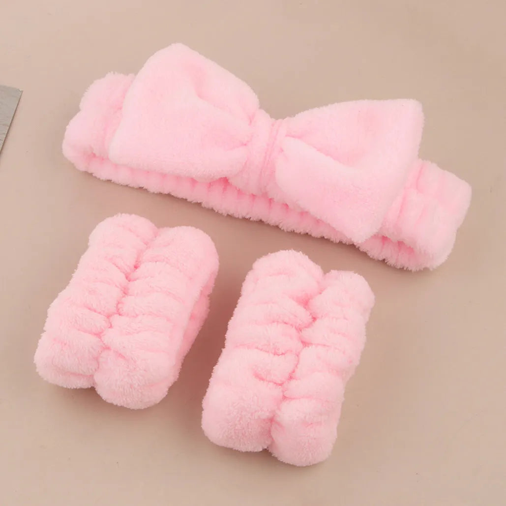 Facial brush set with coral fleece hair band and four nylon brush heads in purple grey white pink colours