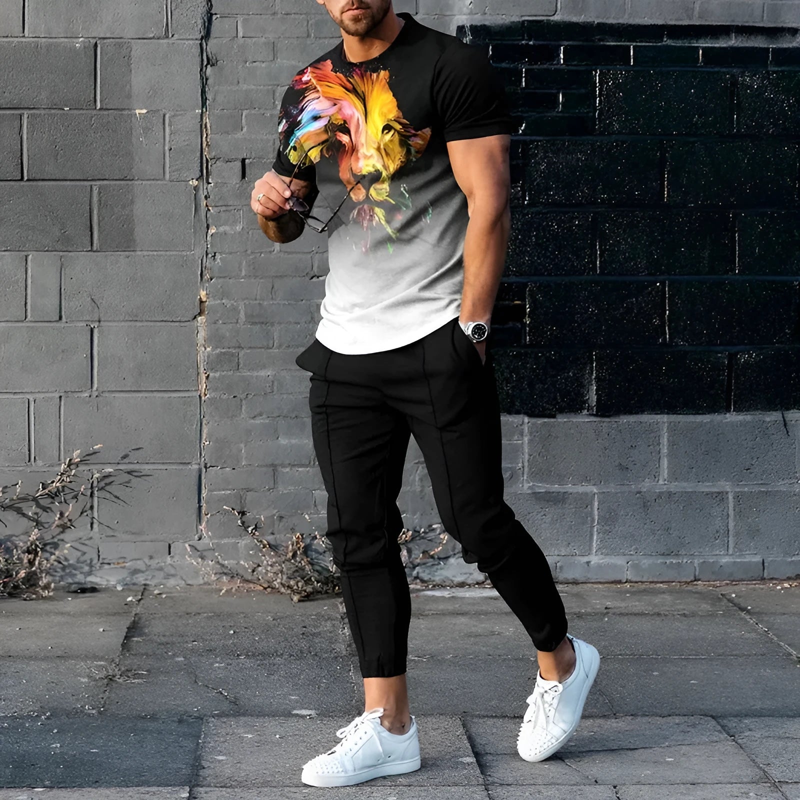 Man wearing a short-sleeved pullover and matching trousers from a polyester-blend suit set.
