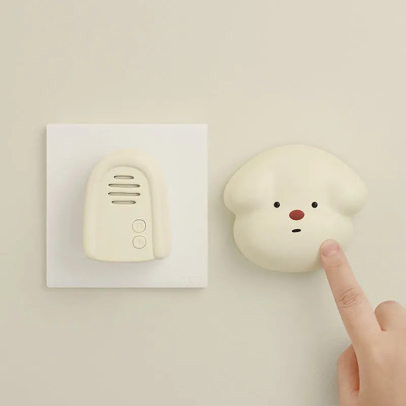 Plug-in wireless doorbell chime and self-generating battery-free button in milky yellow colour.