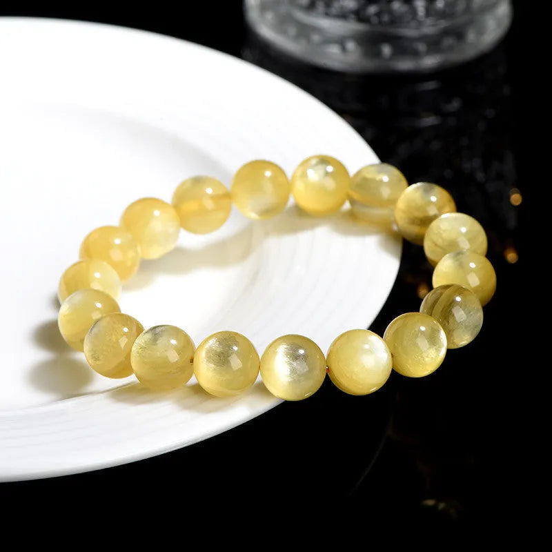 Yellow lepidolite mica bracelet with golden dragon design on round beads