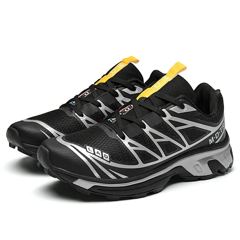 Low-top outdoor hiking shoes in artificial leather with mesh lining and rubber sole.