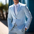Blue and white button men's solid colour double-button suit jacket on a hanger.