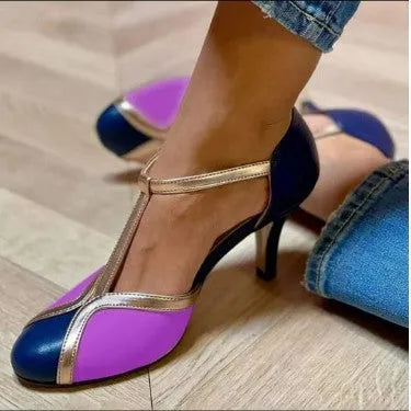Women's round toe high heel shoe in artificial PU leather with button fastening.