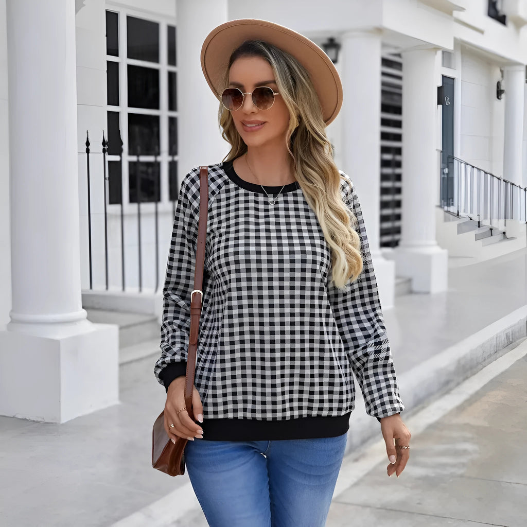 Black men's long sleeve sweater with a striped plaid print pattern.