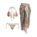 Women's creamy white floral bikini set with halter top, briefs, and a detachable ruffled skirt.