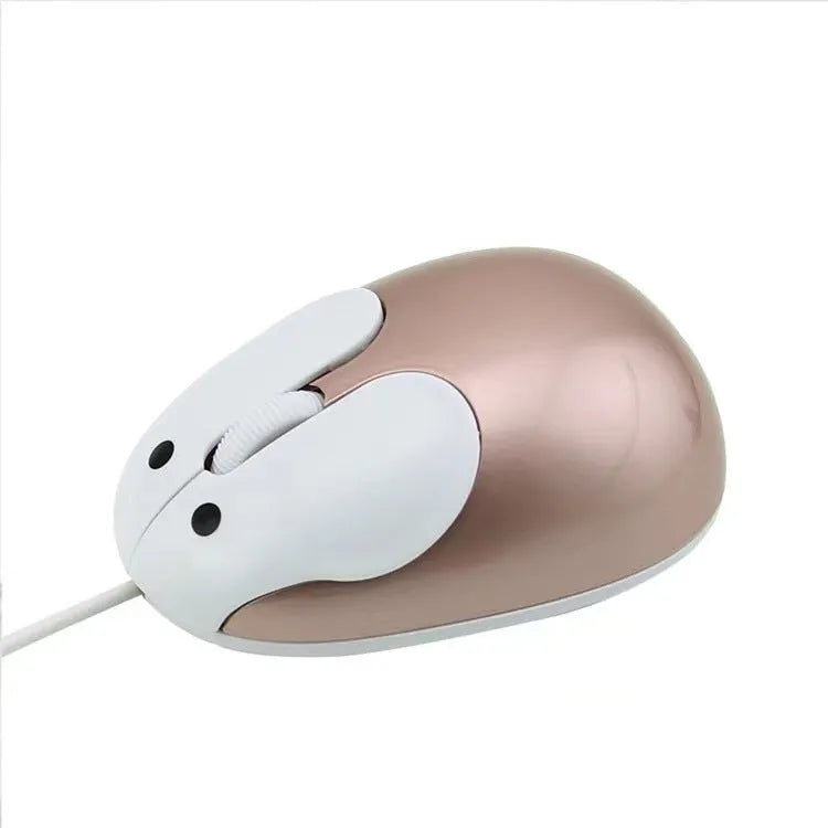 Pink wired rabbit mouse on desktop with USB cable and scroll wheel