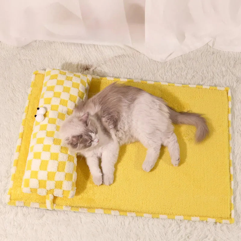 Grey rectangular plush pet cushion for dogs or cats on a wooden floor.