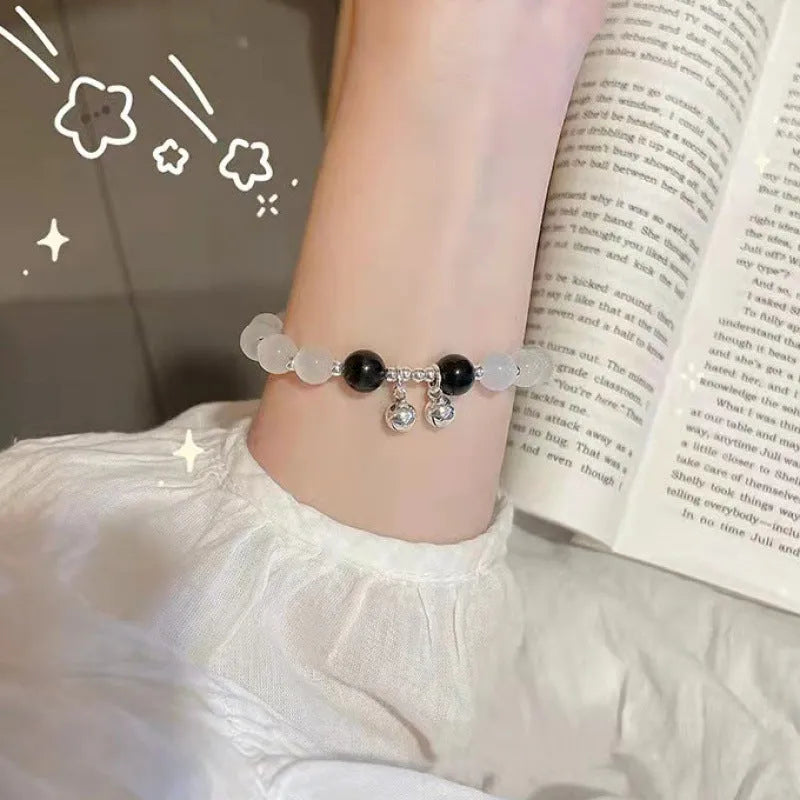 Chinese style glass bead bracelet with bamboo leaf design and manual craftsmanship details.