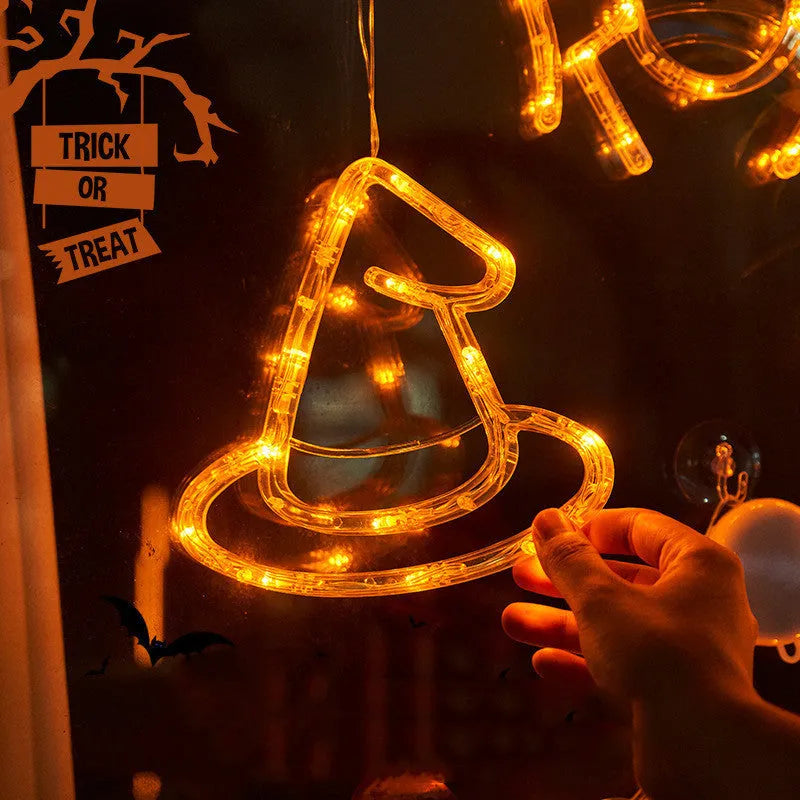 Seven Halloween LED window lights with spider, pumpkin, and ghost designs featuring suction cups for mounting