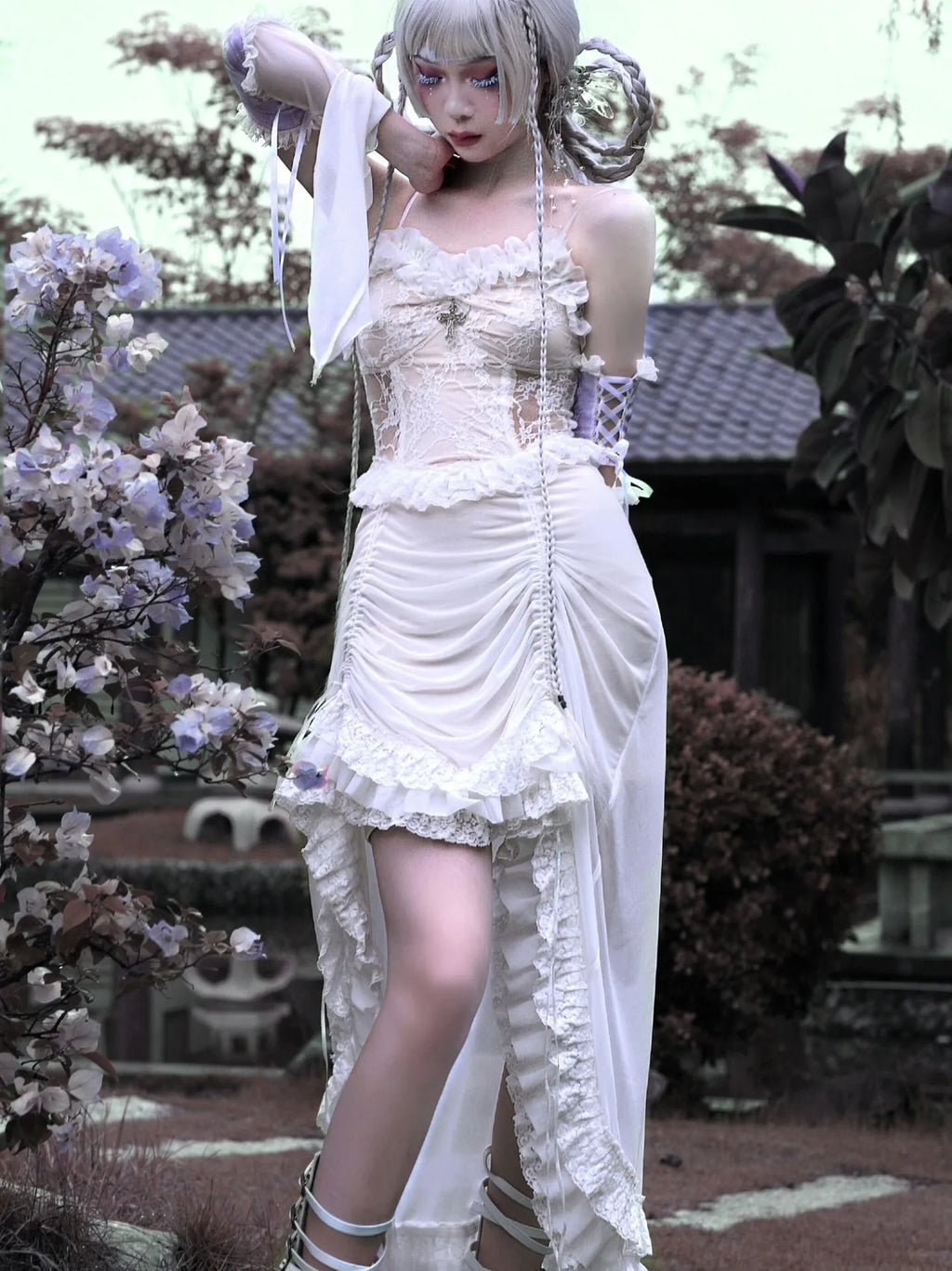 Chinese style white gothic drawstring mesh dress with dark straps and detached oversleeves on display