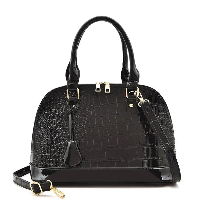 Large shiny black PU leather crossbody shoulder bag with a shell shape.