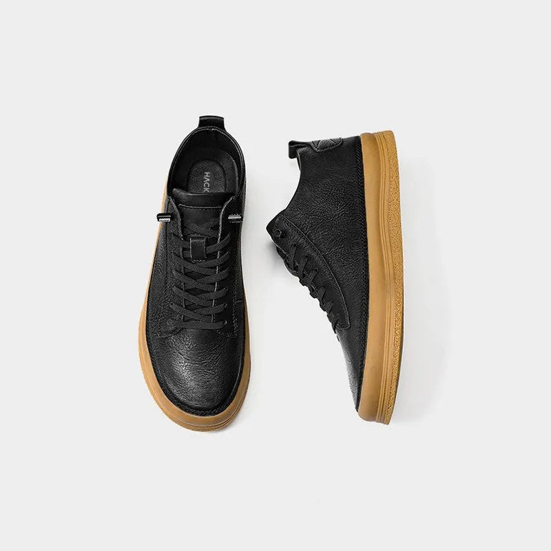 Men's black casual leather shoes with round toe and lace-up lanyard on a white background.