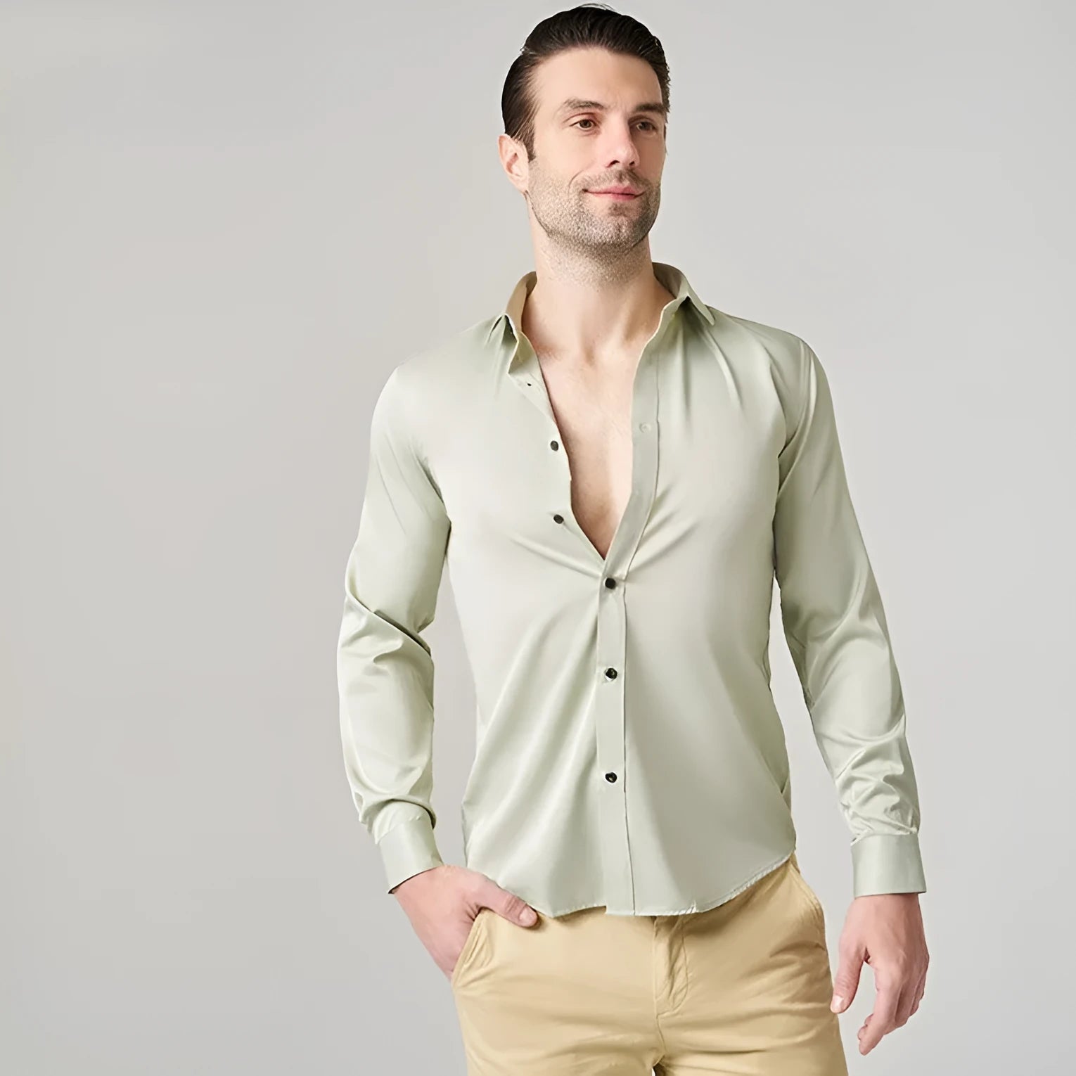 Men's grey stretch long sleeve work shirt made from polyester fabric on a hanger