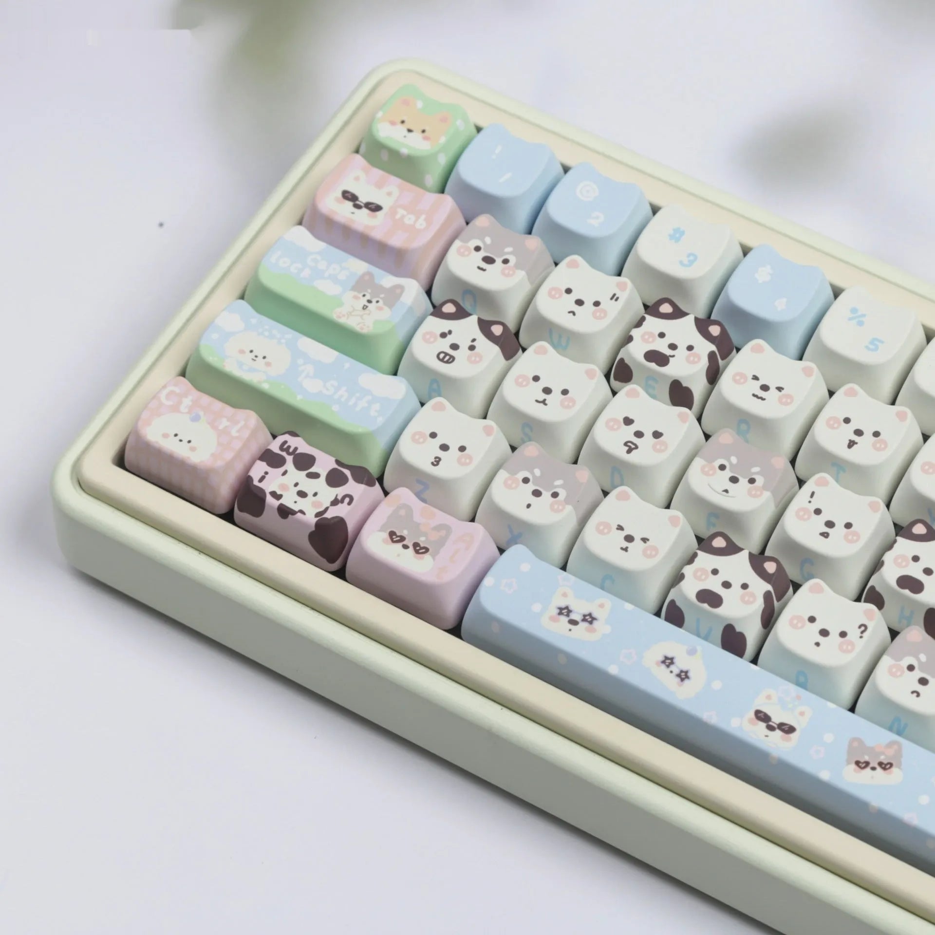 PBT sublimation keycap set showing cat and puppy character designs on mechanical keyboard keys