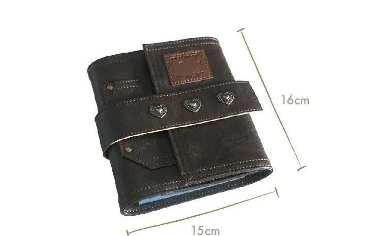 Brown A7 size notebook with a PU leather-look cover and metal buckle closure.