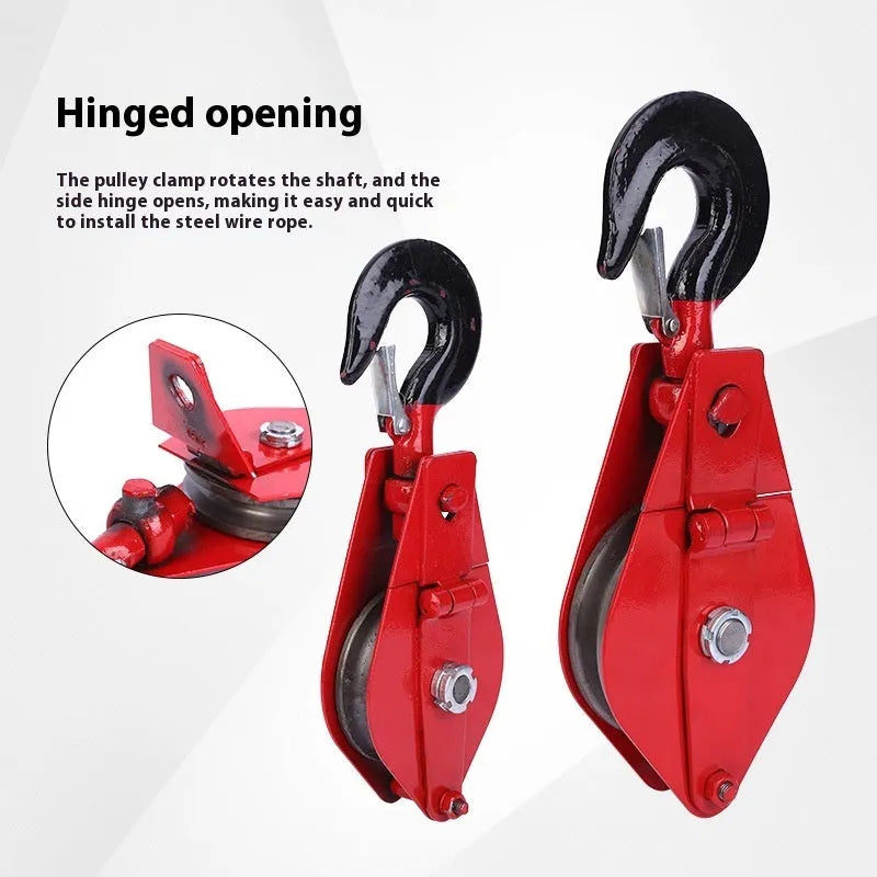 Small red industrial lifting pulley with a steel hook and safety latch for wire rope.