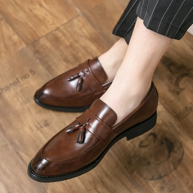 Men's black slip-on business casual leather shoes with tassel detail and rubber sole