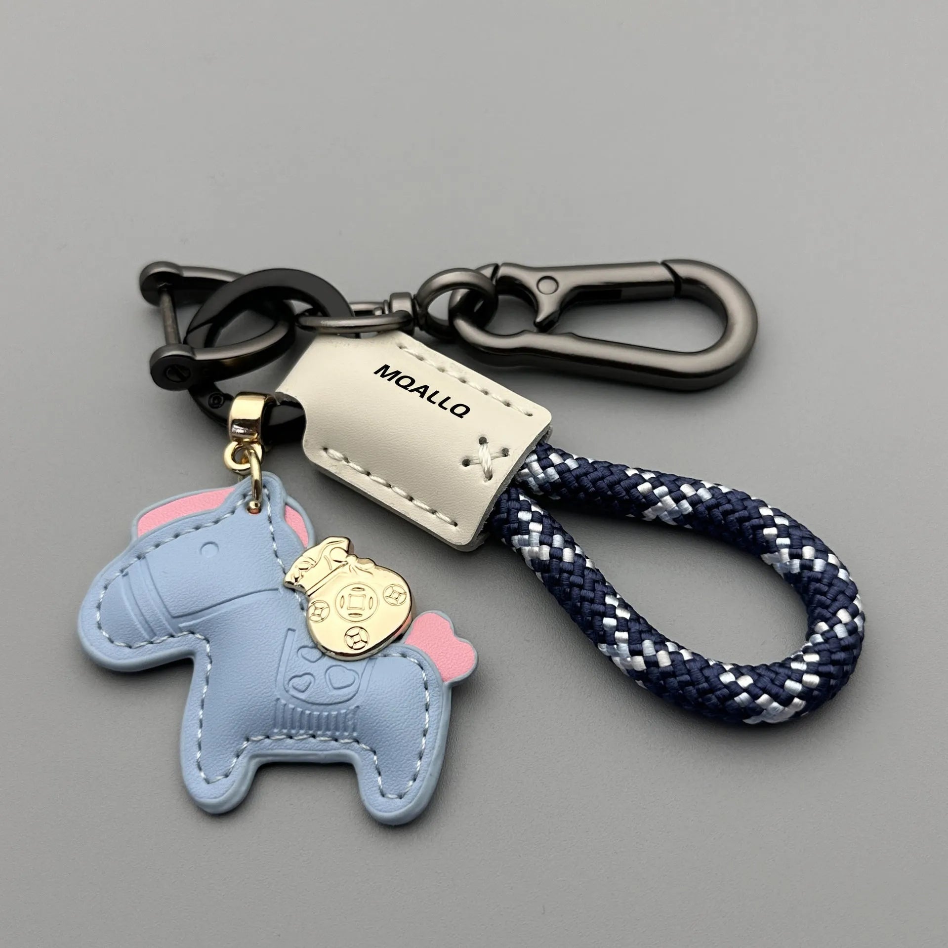 Handmade brown cowhide key ring pendant with a zinc alloy pony belt buckle and green flanelle rope.