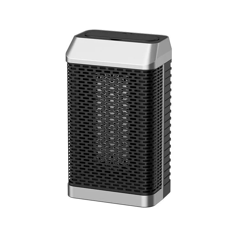 Black remote control desktop heater with oscillating grill on a wooden desk