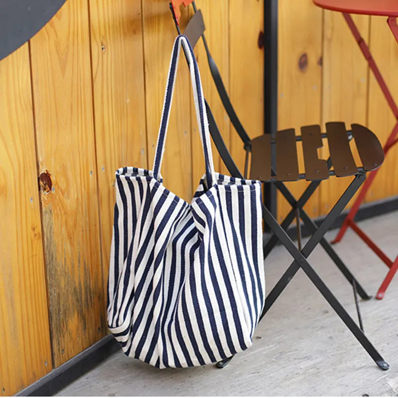 Striped canvas shoulder bag in black, blue, or red with 39cm bottom length, 35cm height, 21cm thickness, and certificate bag.
