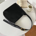 Two women's soft PU shoulder bags with swing thread detailing in black and brown colour options