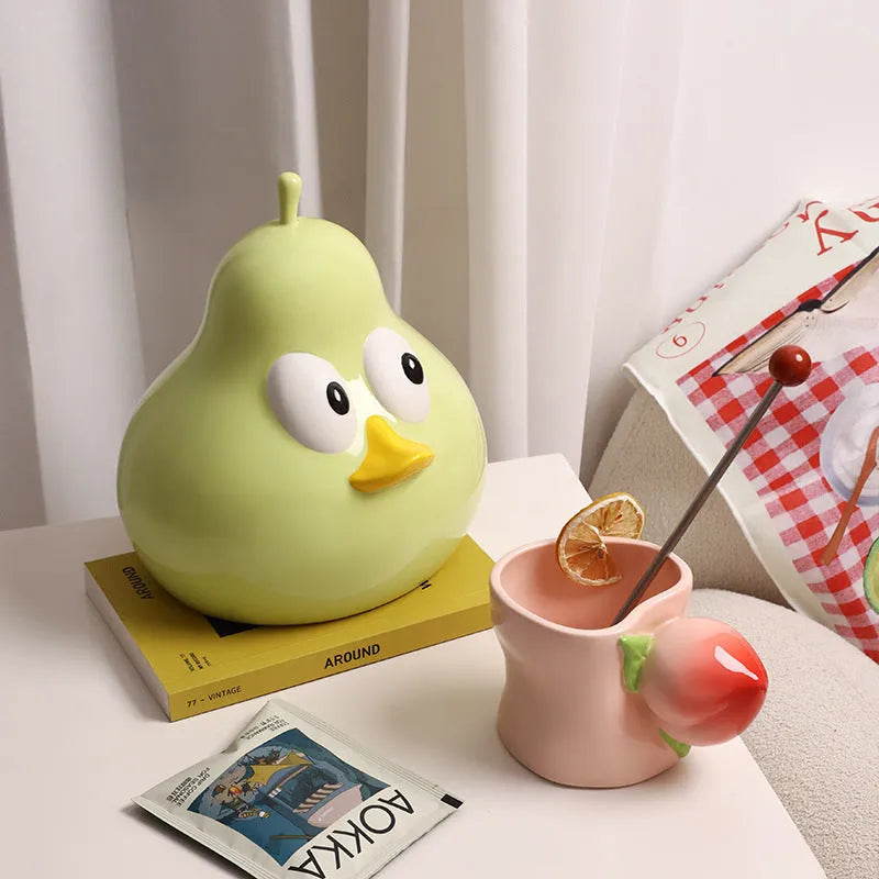 Cute pear-shaped ceramic tissue box holder in white porcelain available in green or black colours