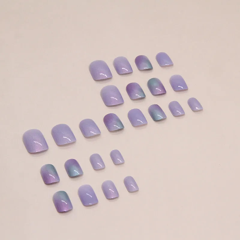 Short fake nails in bright starry sky pattern, 24-piece set with glue, aurora armour style for ladies.
