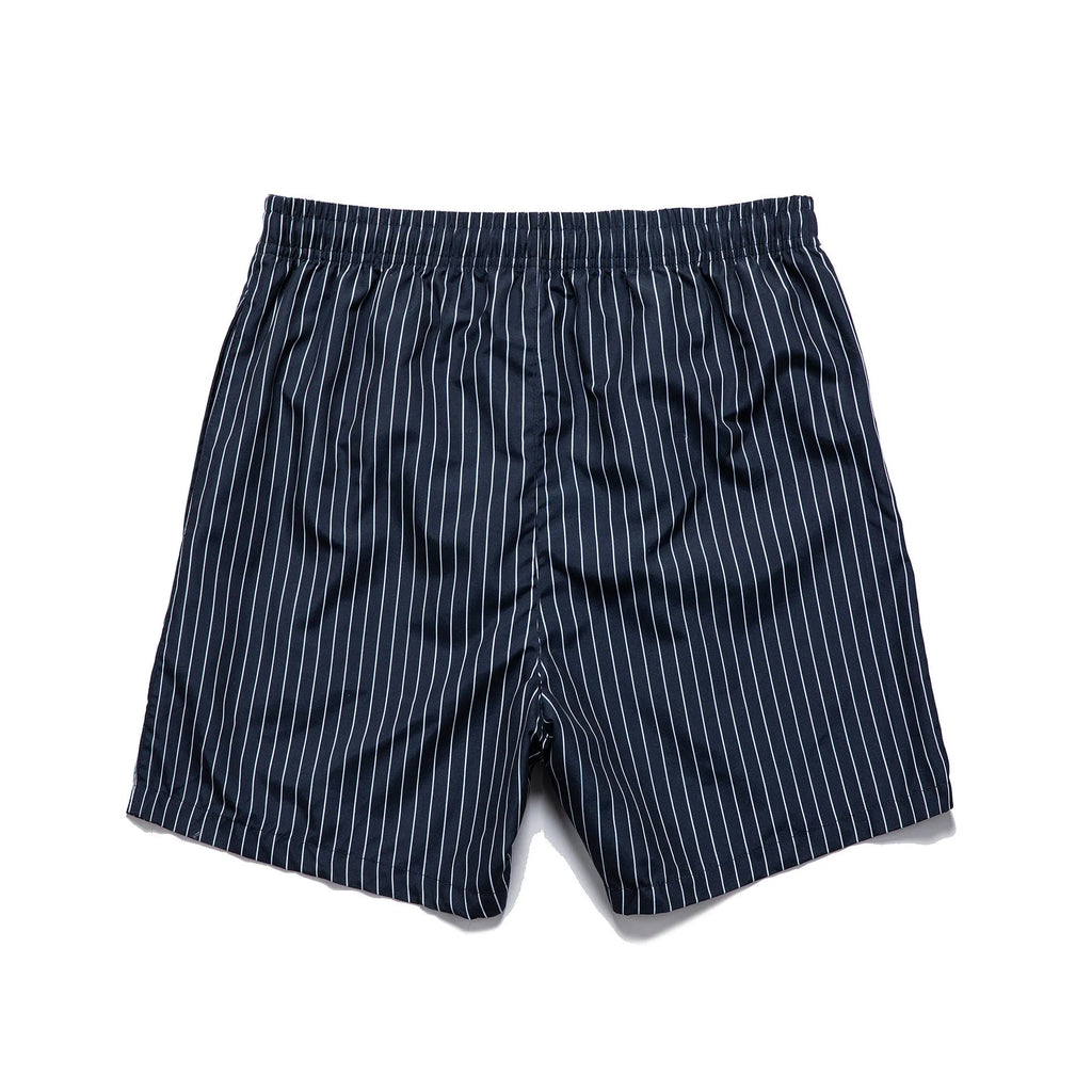 Men's navy blue and grey striped polyester beach shorts with a straight leg cut, laid flat.