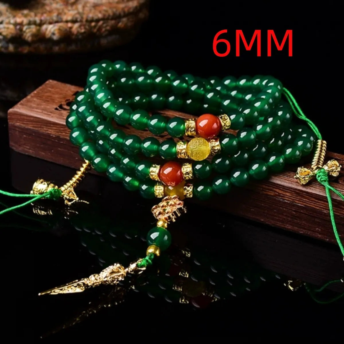 Handmade multi-strand green agate bracelet from Brazil on a wrist, showing stone sizes 6mm, 8mm, and 10mm.