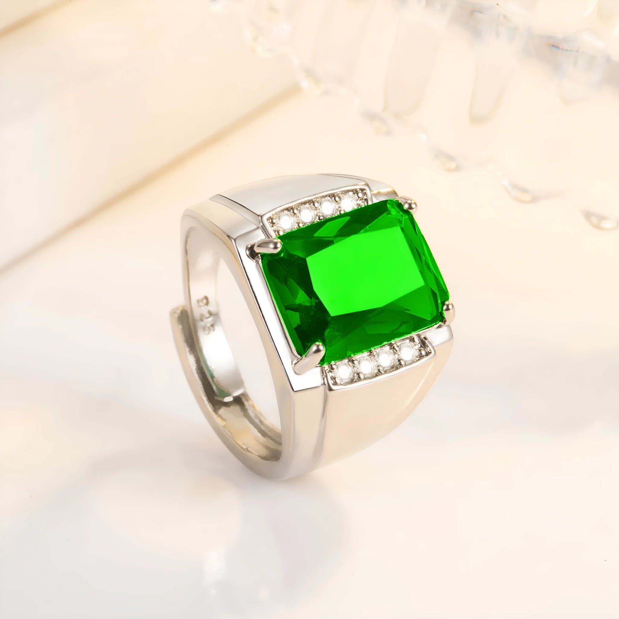 Adjustable copper ring with geometric band and a colourful rhinestone in a white gold coloured setting.