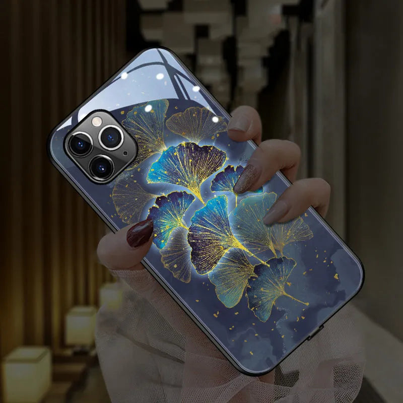 Light blue glow phone case for iPhone showing tempered glass back with TPU edge