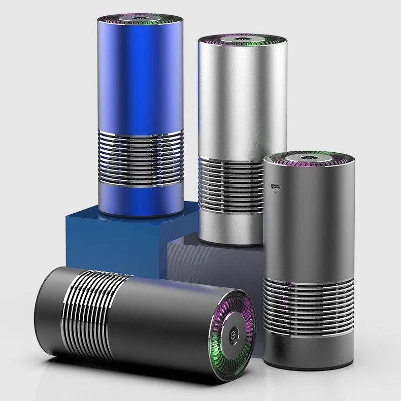 Wireless car air purifier in black, metallic grey, or silver colours, showing compact size for dashboard use.