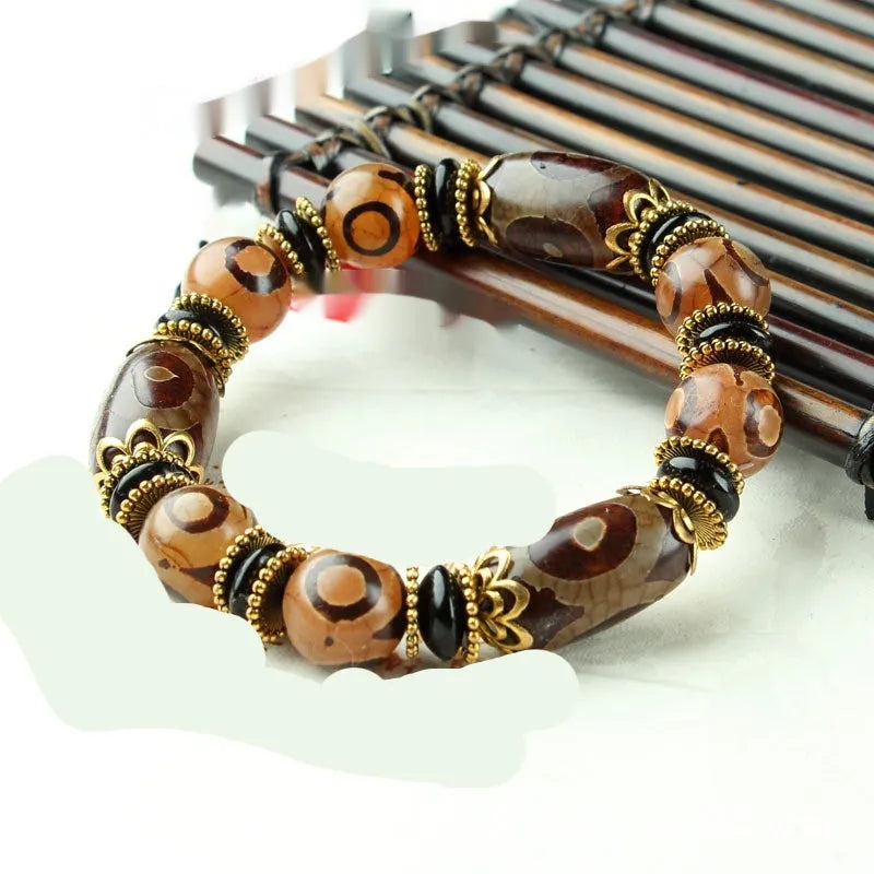 Distressed agate Tibet beads bracelet with three eye dzi design and polished stone beads