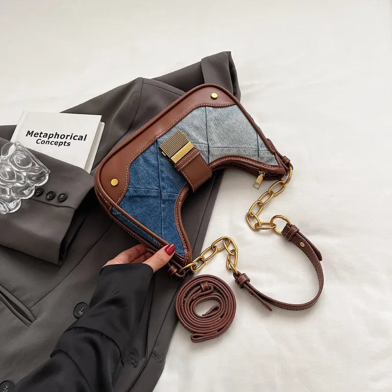 Brown denim women's bucket shoulder bag with diamond chain straps and lock detail