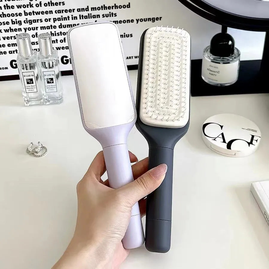 Roland purple self-cleaning hair brush with rotating handle and anti-static teeth