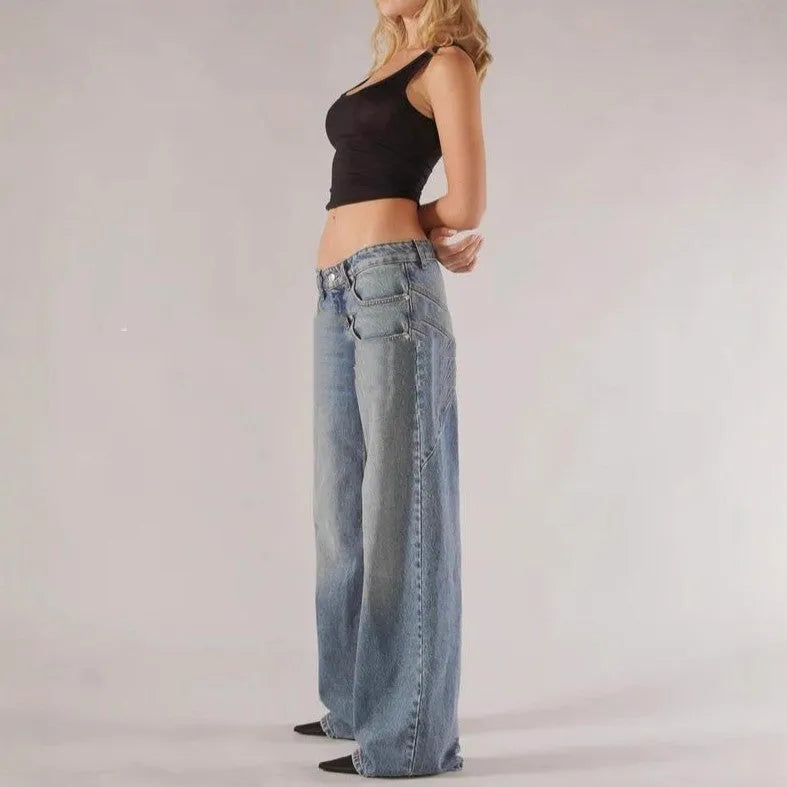 Blue loose fit wide leg mop trousers with low waist and straight leg cut on a person.