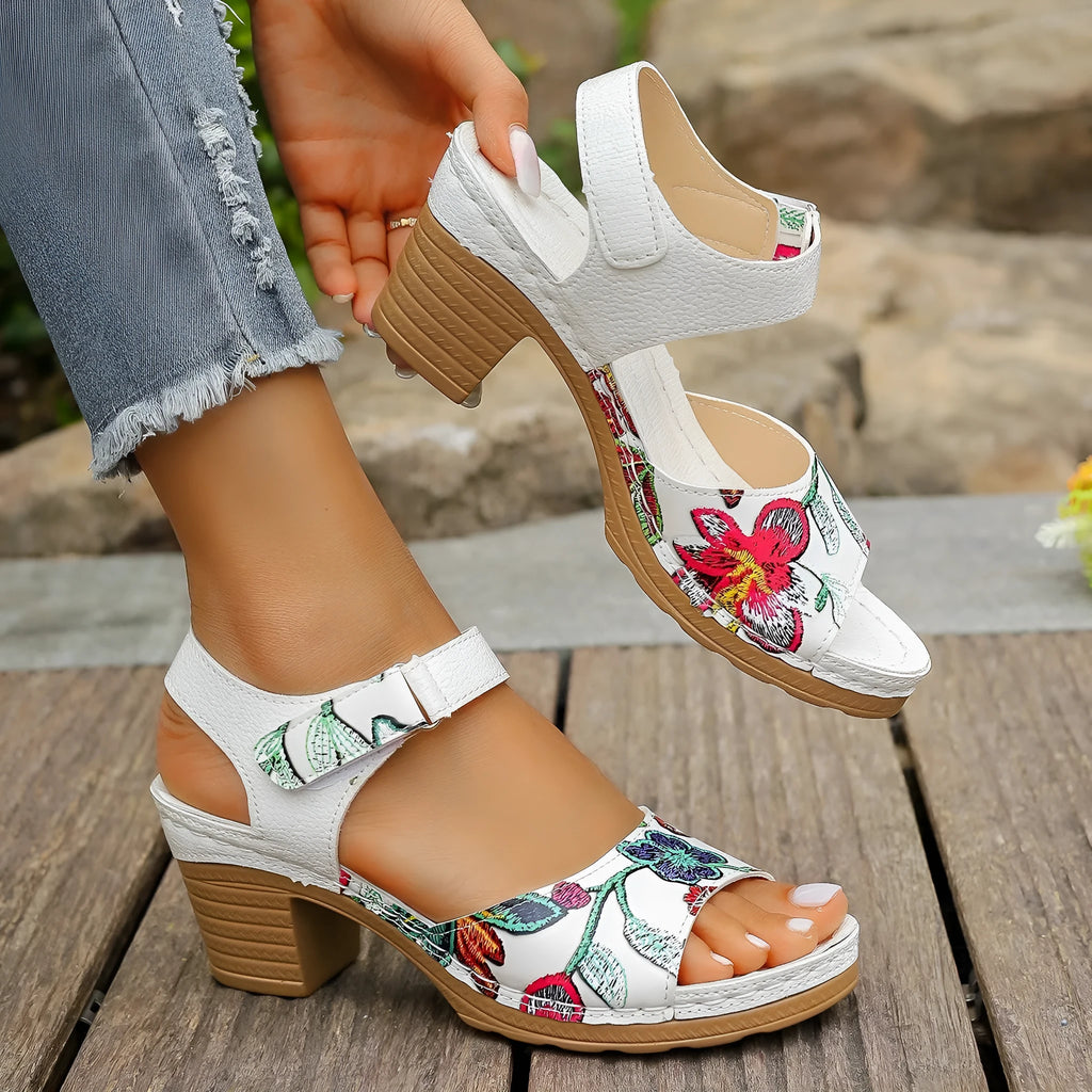 White women's casual sandals with high heel, Velcro buckle straps, and rubber sole.