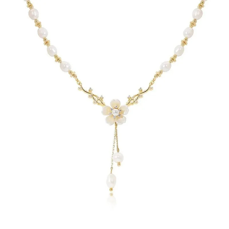 Alloy necklace with pearl flower pendant and floral design elements