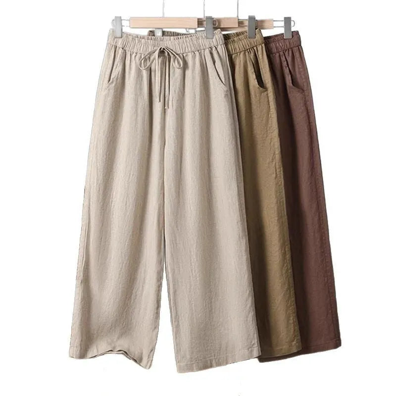 Women's straight-leg casual trousers with elastic waist and lace-up drawstring detail in polyester fabric