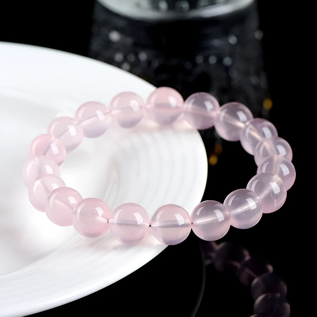 Polished natural crystal bracelet with round beads in pink colour, available in multiple bead diameters
